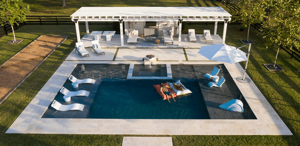 Swimmming pool tanning ledge and in pool furniture. GodoPools