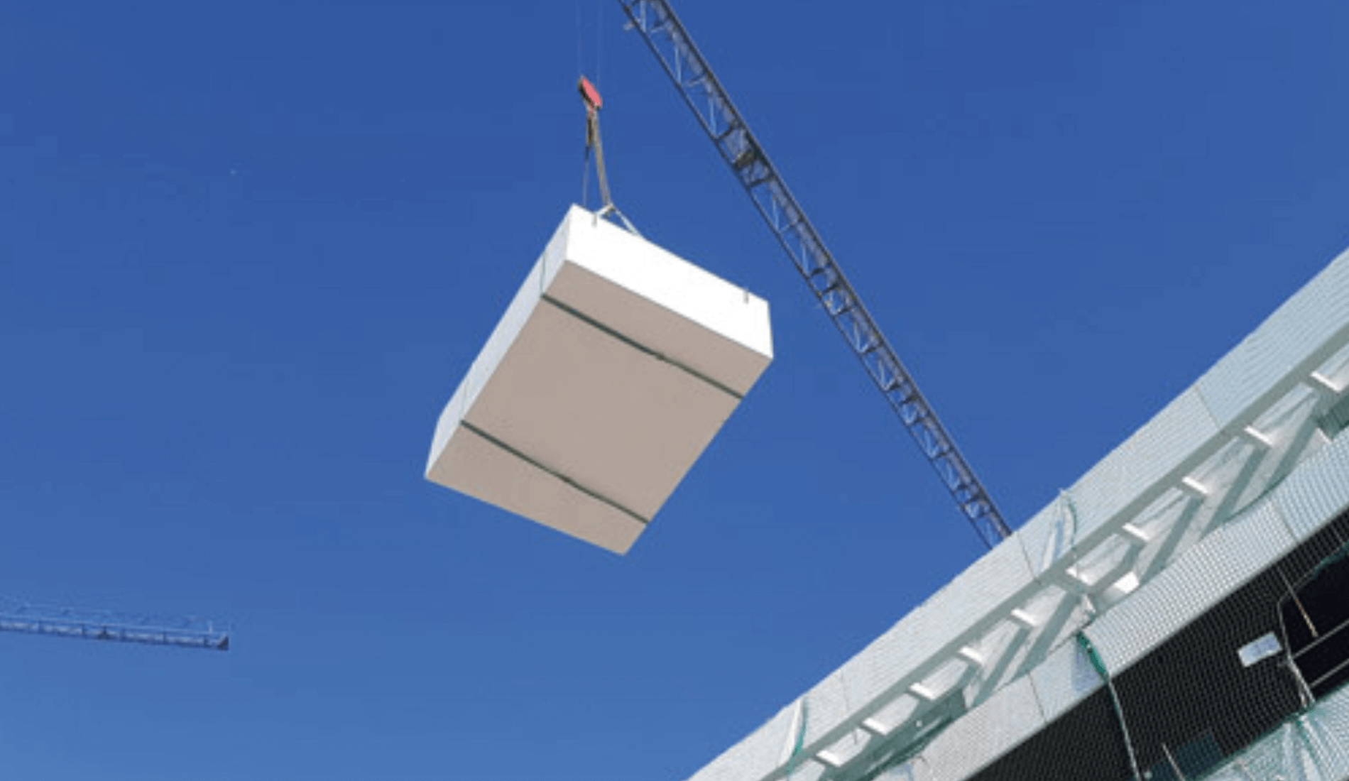 Modular EPS pool transported by crane to the attic of a building