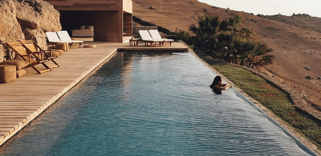 Design pool made up with wood and natural stone 