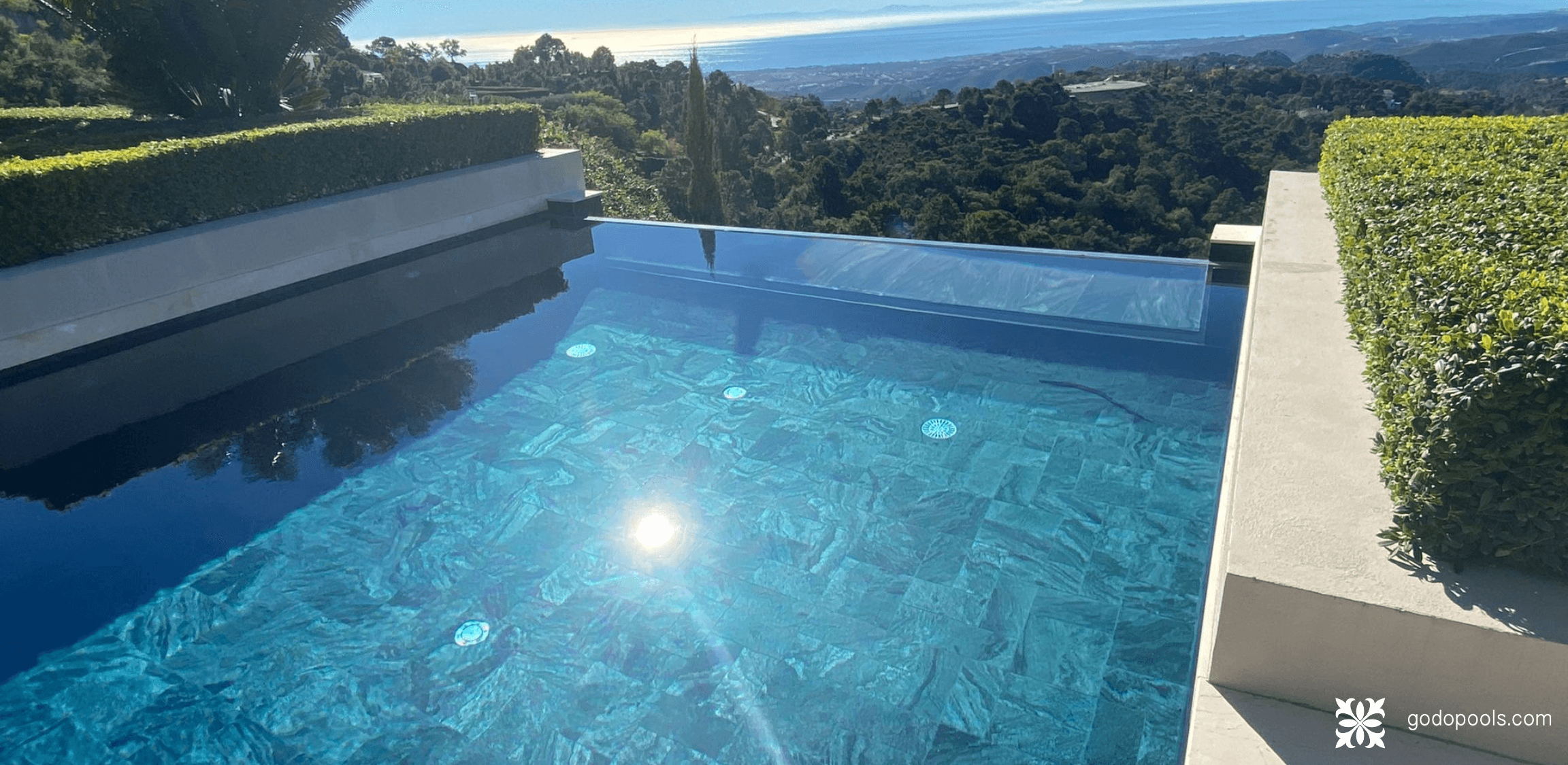 Pool lined with a sustainable natural stone material. GodoPools Grigio Piombo Project